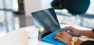 Person Using Blue Microsoft Surface