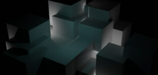 A Black And White Photo Of Cubes In The Dark